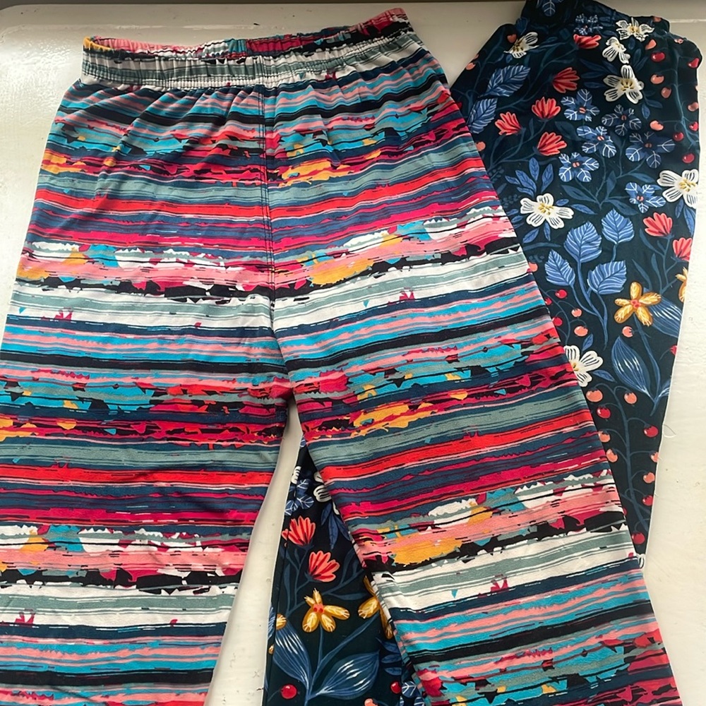 Two pairs Agnes & Dora S/M adult leggings fit US sizes 4-12. Near new condition